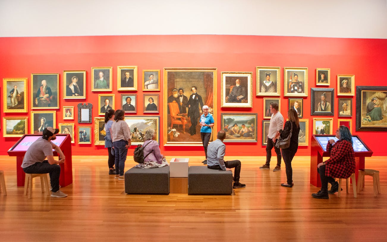 Visitors viewing portrait gallery at Museum of NZ Te Papa Tongarewa.