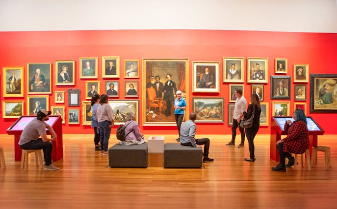 Visitors viewing portrait gallery at Museum of NZ Te Papa Tongarewa.