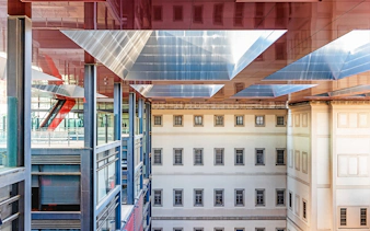 Visitors at Reina Sofia Museum's modern architecture in Madrid, Spain.