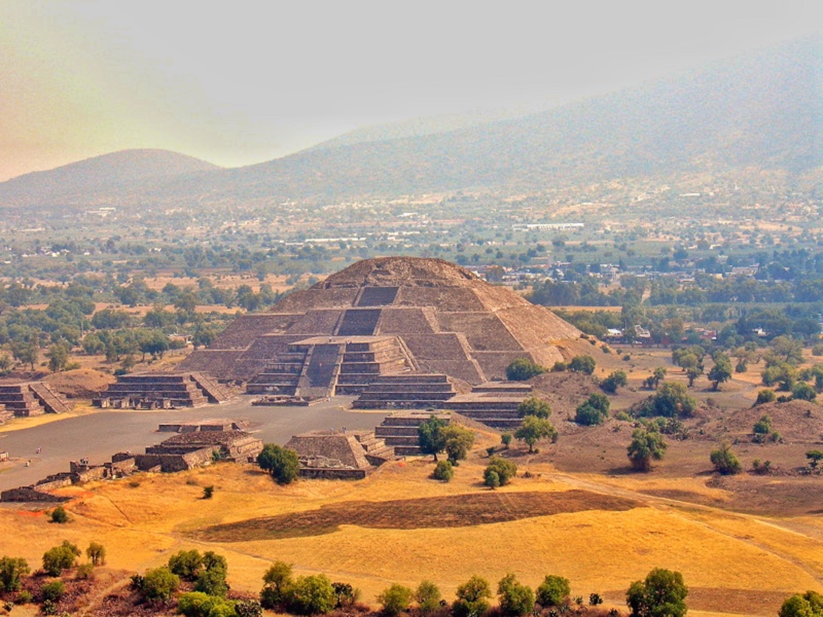 Teotihuacan Pyramid of the Moon with tourists exploring the ancient site in Mexico.