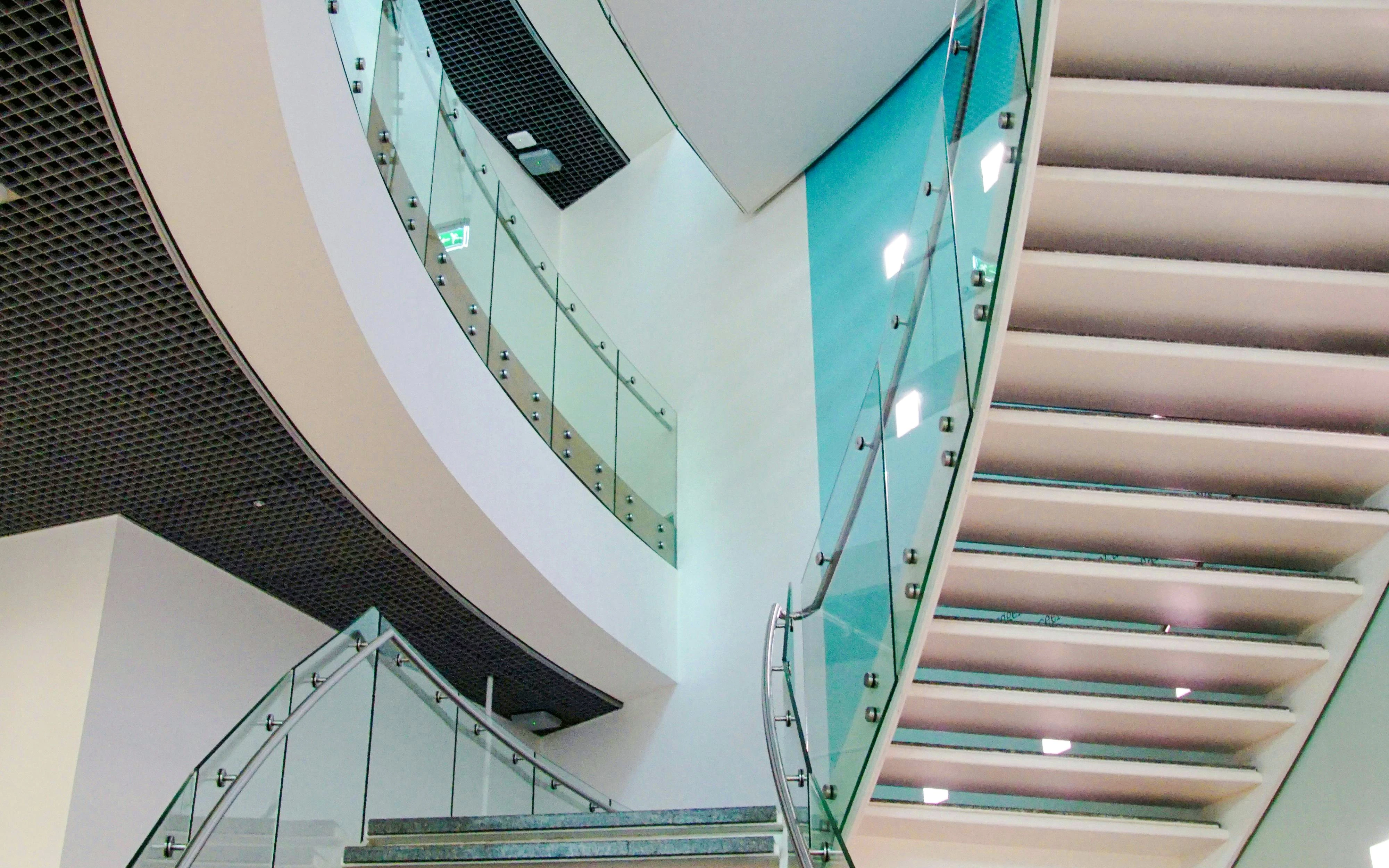 Curved glass staircase inside Van Gogh Museum, Amsterdam.