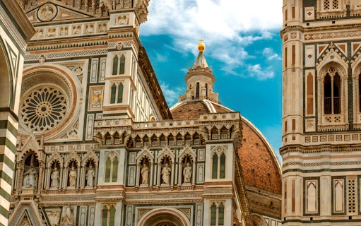 Florence Cathedral facade and dome on a sunny day, part of a full-day tour from Rome.