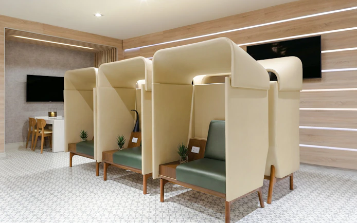 Working pods at MERA Business Lounge, Cancun International Airport.