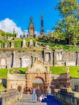 Glasgow Necropolis entrance with Victorian monuments and visitors, Glasgow, Scotland.