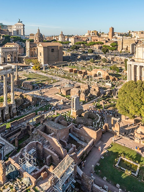 Roman Forum ruins with ancient columns and structures in Rome.
