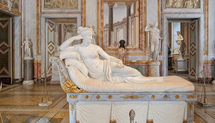 Venus Victrix statue in Borghese Gallery, Rome, showcasing neoclassical art.