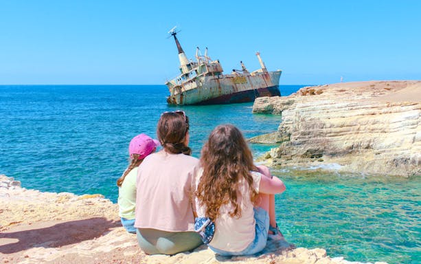 Family viewing Edro III shipwreck near Paphos coast, Cyprus.