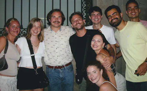 Group enjoying Barcelona bar tour with VIP club entry.