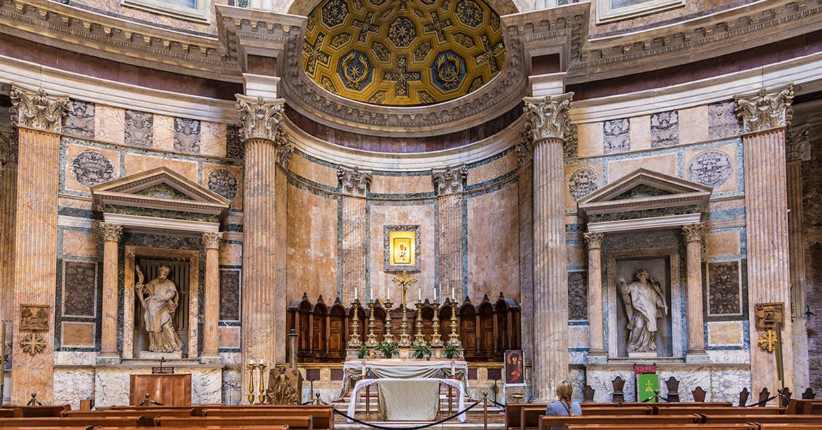 Pantheon altar in Rome with ornate columns and religious statues.