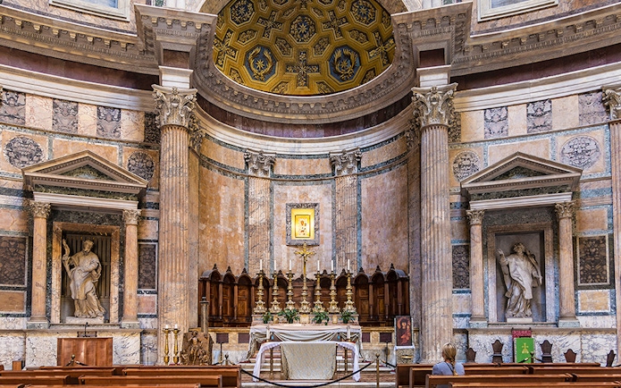 Pantheon altar in Rome with ornate columns and religious statues.
