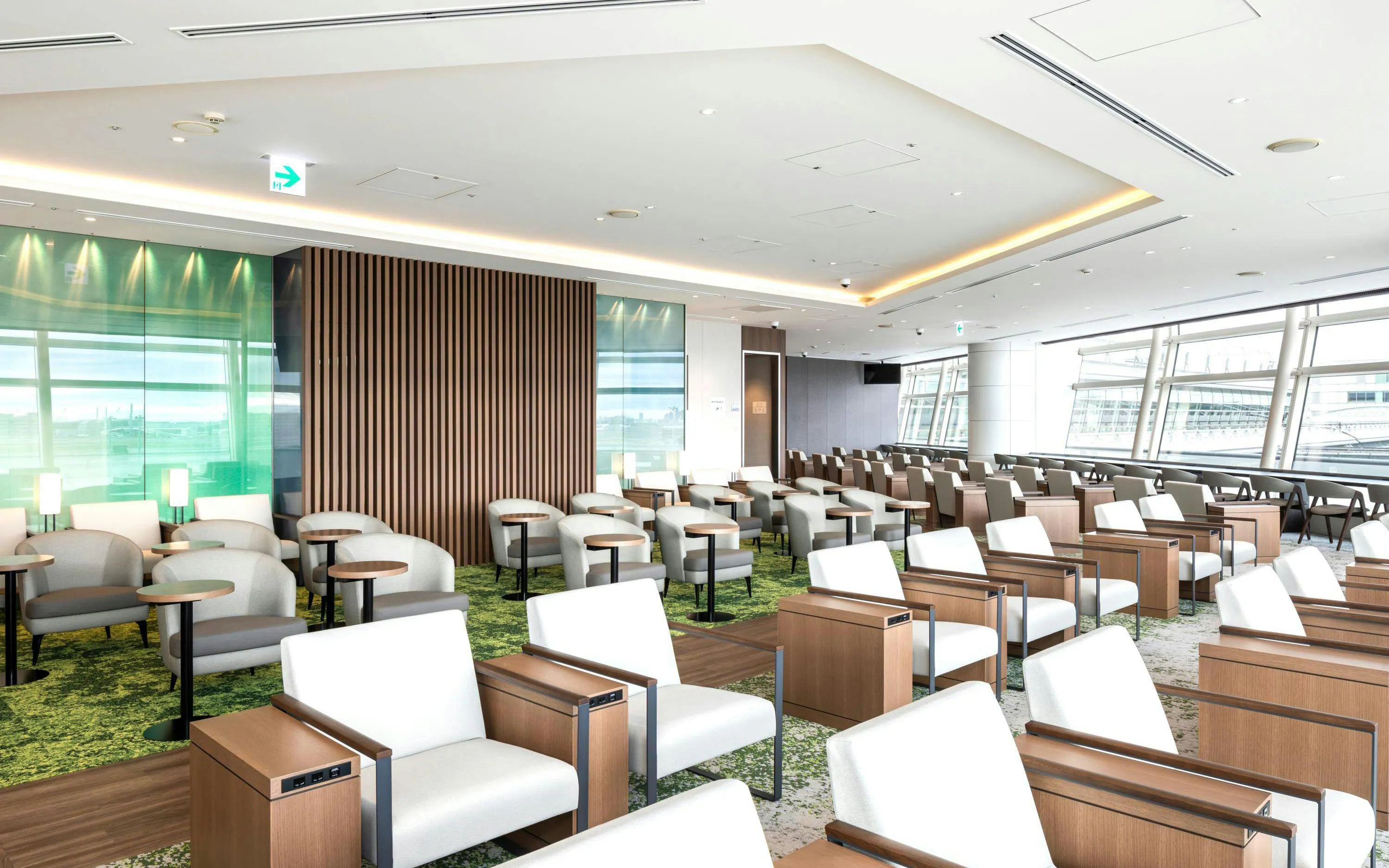 TIAT Lounge seating area at Tokyo International Airport with modern chairs and tables.