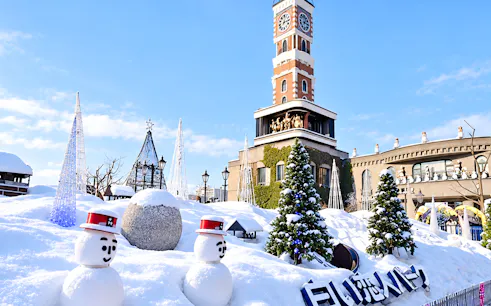 Snow-covered Shiroi Koibito Park with snowmen and clock tower in Sapporo, Hokkaido.