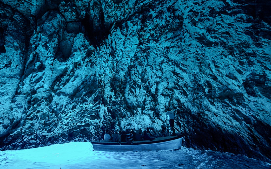 Boat tour inside Blue Cave, Adriatic Sea, Croatia.