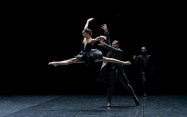 Ballet dancers performing Preljocaj's Swan Lake on stage.