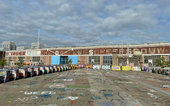 Graffiti-covered shipyard in Amsterdam, part of the Ship-Sinking Secret self-guided city exploration game.