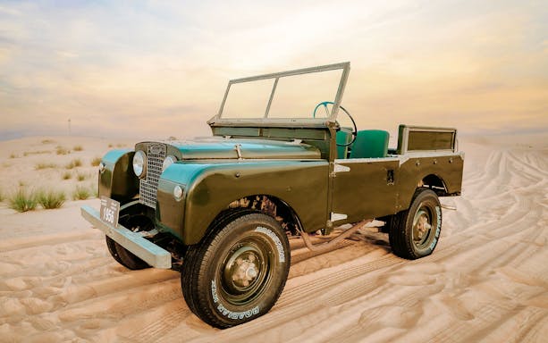 Vintage Land Rover on desert sand during 57 Heritage Desert Safari.