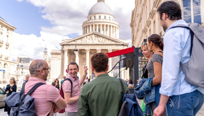 Tourist walking through Paris's Latin Quarter, exploring historic literary sites.