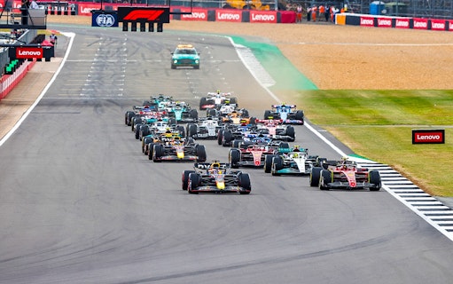 Formula 1 cars racing at the British Grand Prix, Silverstone Circuit.