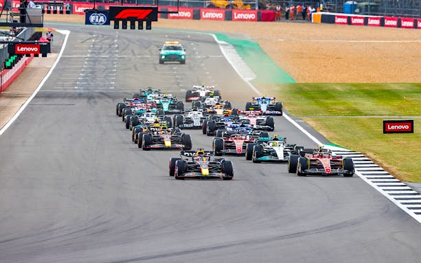 Formula 1 cars racing at the British Grand Prix, Silverstone Circuit.