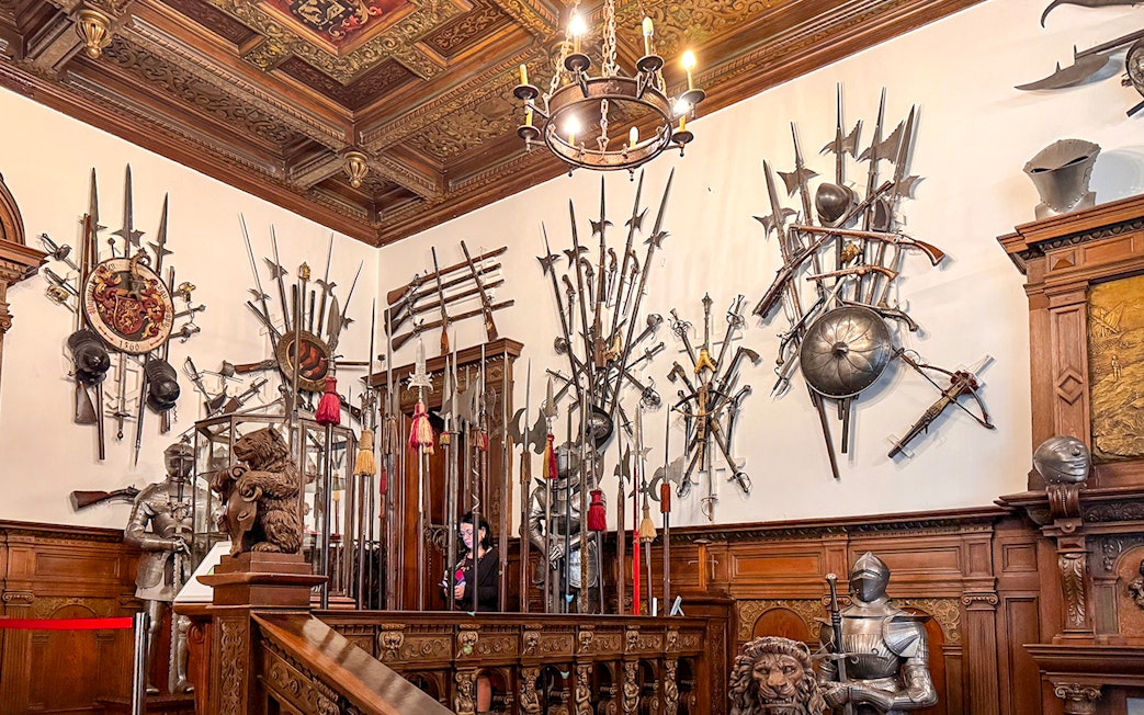 Medieval weapons display inside Peles Castle, Romania.