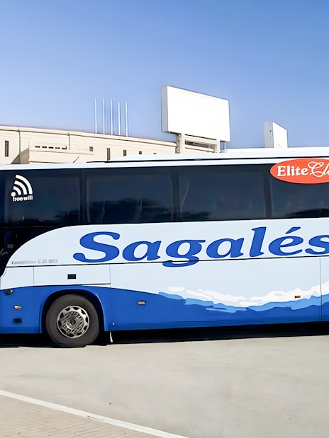 Bus at Girona Airport for transfer to Barcelona City Center.