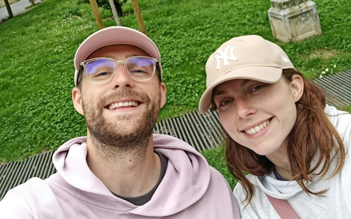 Self-guided city exploration in San Sebastian with two smiling participants.
