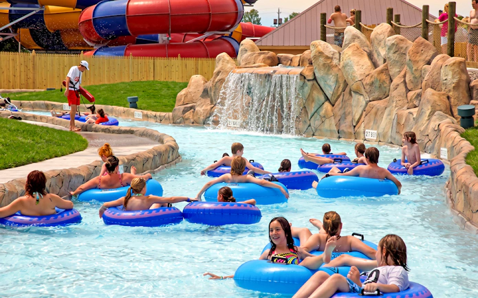 Visitors floating on tubes at Flotation Station, Six Flags Darien Lake.