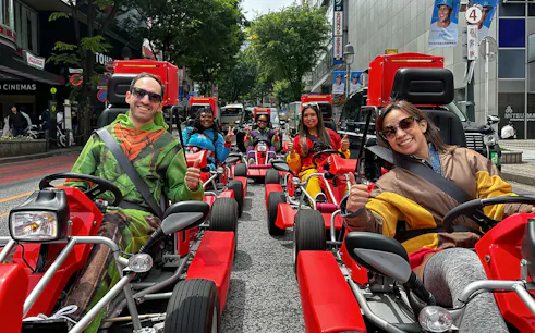People in costumes driving go-karts on a Shibuya street during a 1-hour tour.
