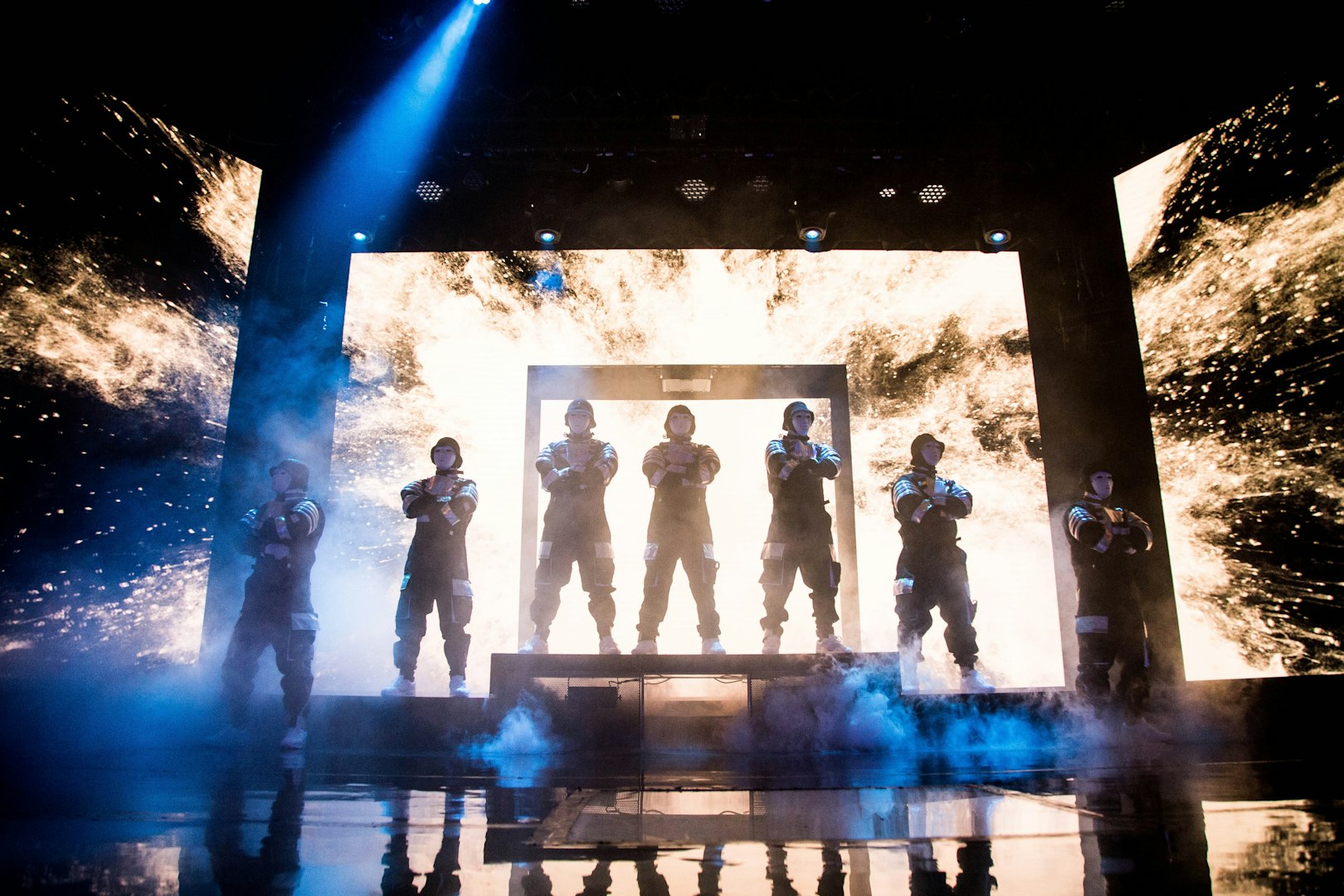 Jabbawockeez dancers performing on stage with dynamic lighting in Las Vegas show.