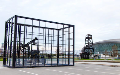 Oil well display and modern architecture in Baku, Azerbaijan.