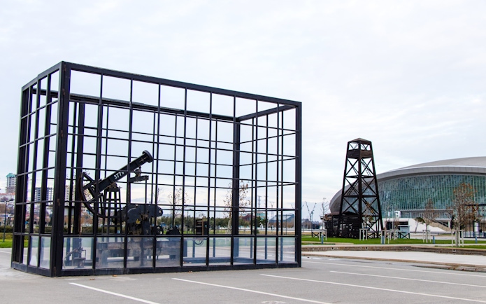 Oil well display and modern architecture in Baku, Azerbaijan.