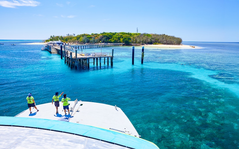 Catamaran approaching Green Island pier on Full Day Reef Cruise, Australia.