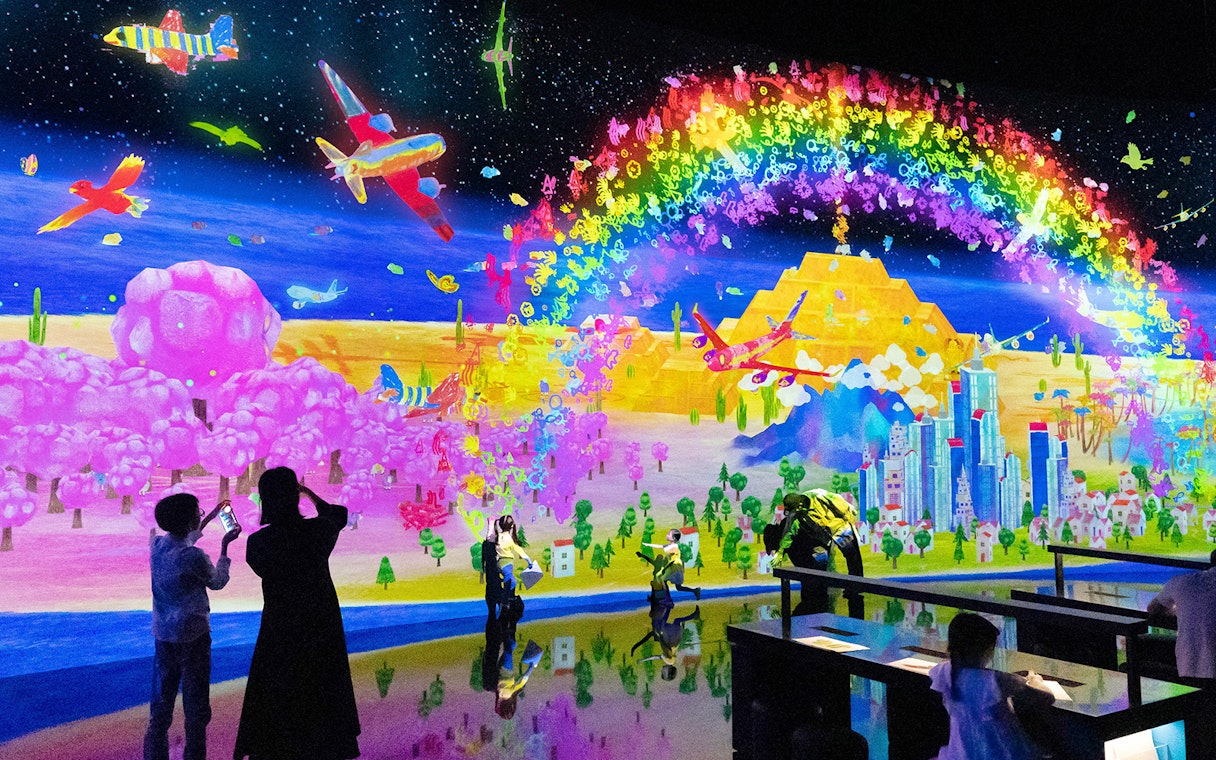 Teamlab digital art installation with vibrant colors at ArtScience Museum, Singapore.