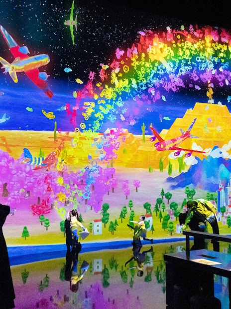 Teamlab digital art installation with vibrant colors at ArtScience Museum, Singapore.