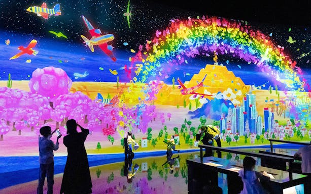 Teamlab digital art installation with vibrant colors at ArtScience Museum, Singapore.