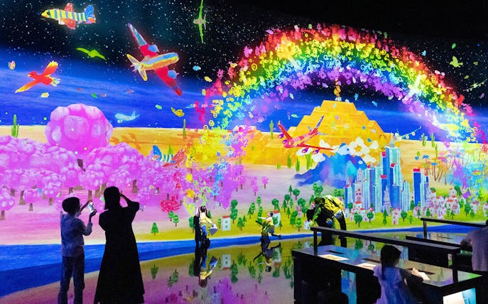 Teamlab digital art installation with vibrant colors at ArtScience Museum, Singapore.