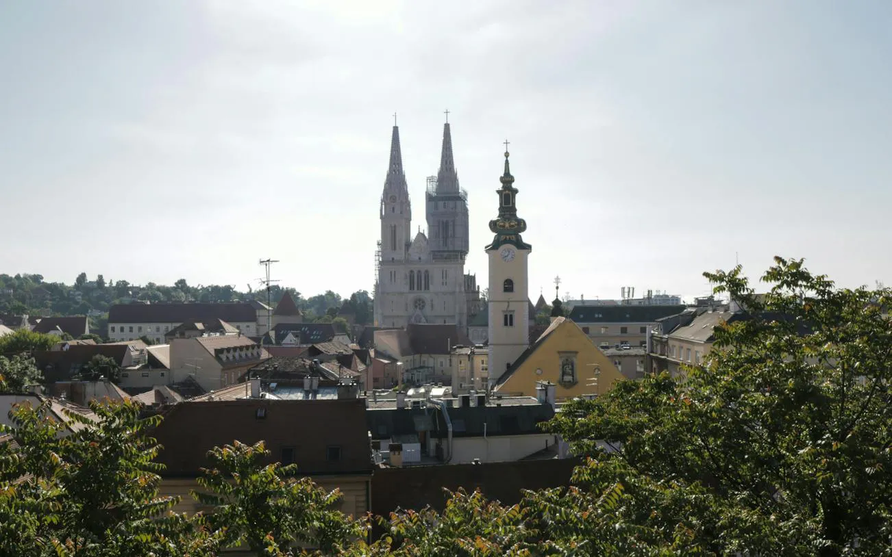 Zagreb Cathedral and cityscape view from a scenic spot during a self-guided exploration game.