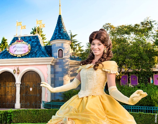 Princess Pavilion entrance with character in yellow dress at Disneyland Paris.