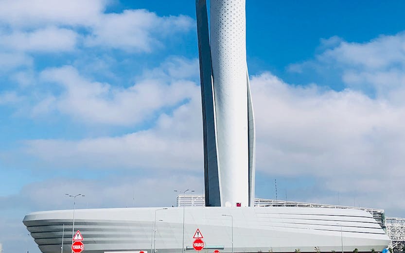 Control tower at Istanbul Airport under a clear blue sky.