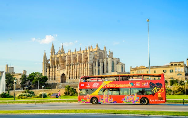 Palma de Mallorca hop-on hop-off bus near Palma Cathedral.