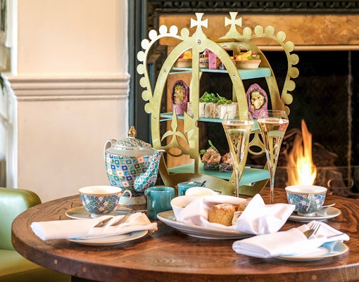 Afternoon tea setup with pastries and tea set at Windsor Castle.