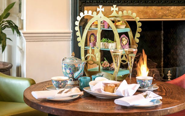 Afternoon tea setup with pastries and tea set at Windsor Castle.