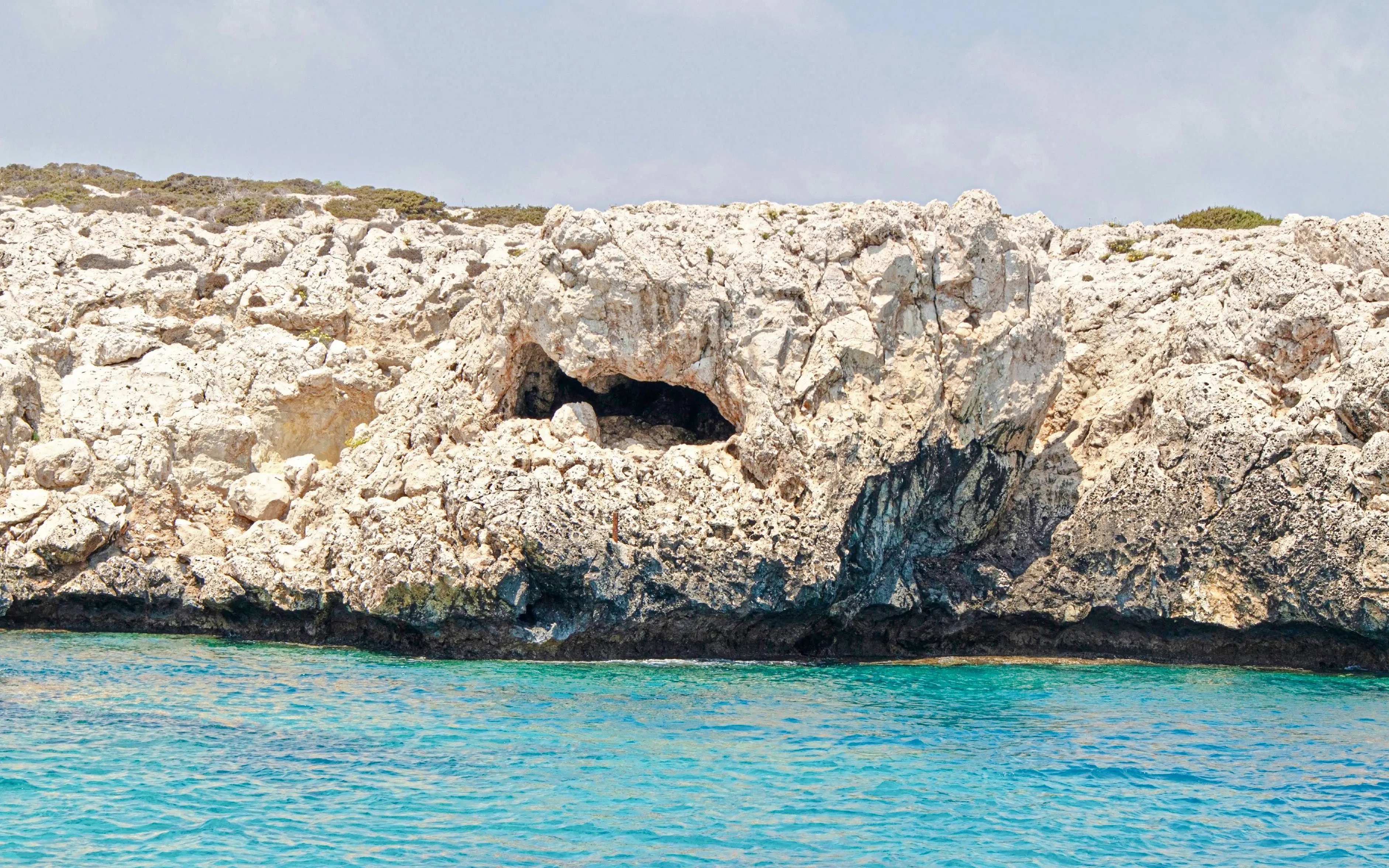 Sharks Mouth Cave at Cape Greko viewed from the sea, Protaras, Cyprus.
