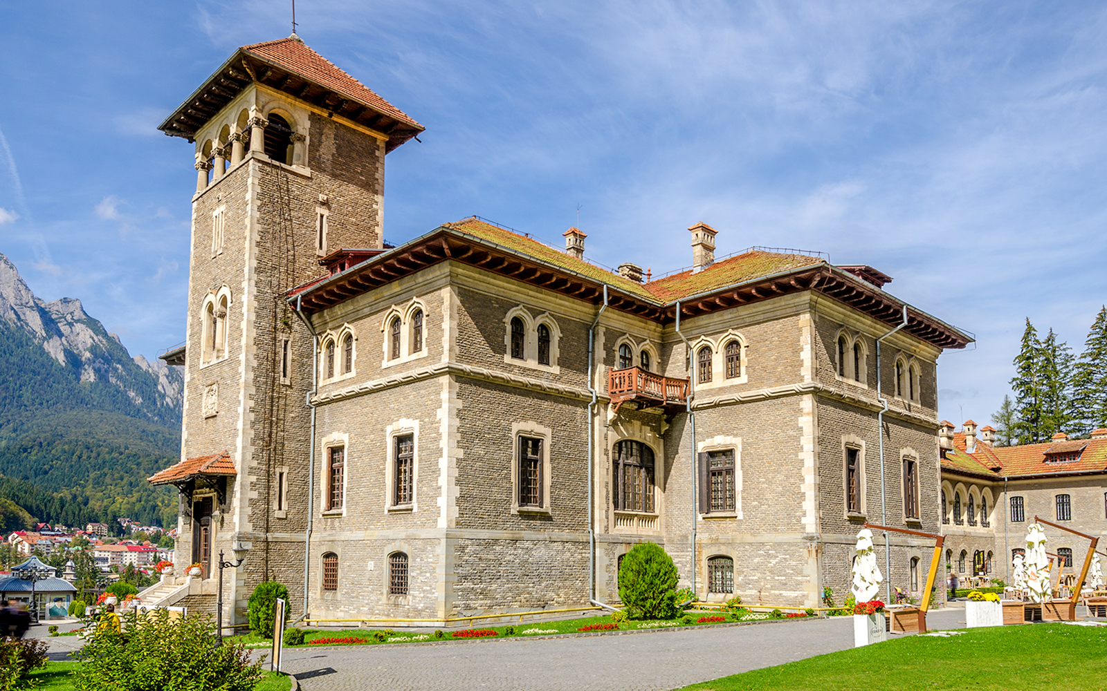 Cantacuzino Castle in Busteni Mountains with scenic backdrop.