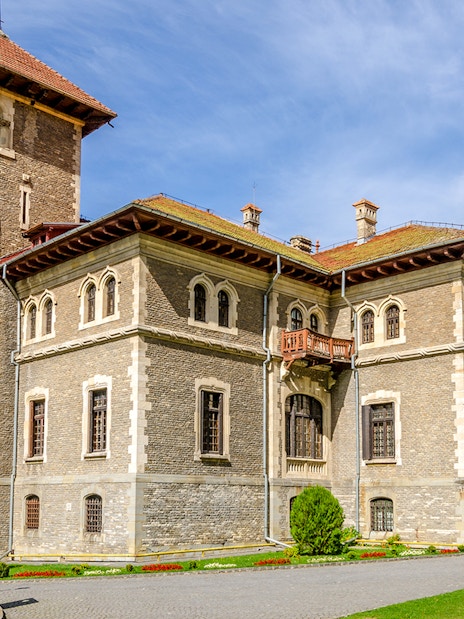 Cantacuzino Castle in Busteni Mountains with scenic backdrop.