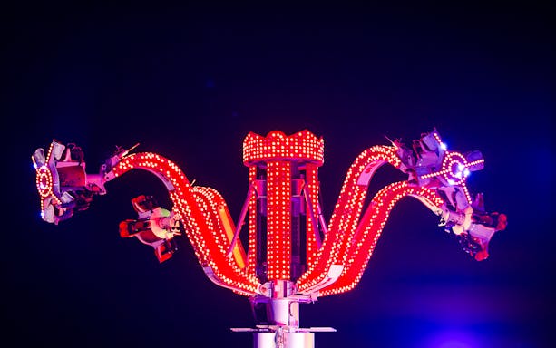 Thrill ride with red lights at Lusail Winter Wonderland.