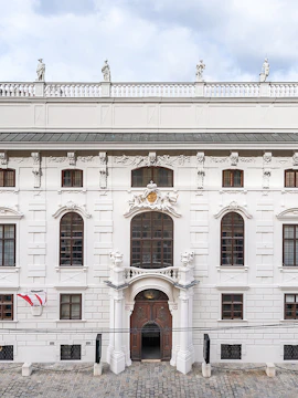 Palais Lobkowitz facade with ornate windows and statues, Vienna, Austria.