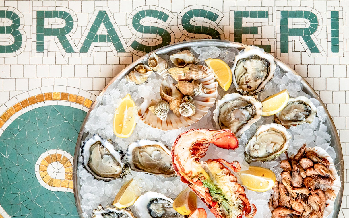 Seafood platter with oysters, lobster, and lemon at Brasserie Rosalie.
