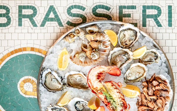 Seafood platter with oysters, lobster, and lemon at Brasserie Rosalie.