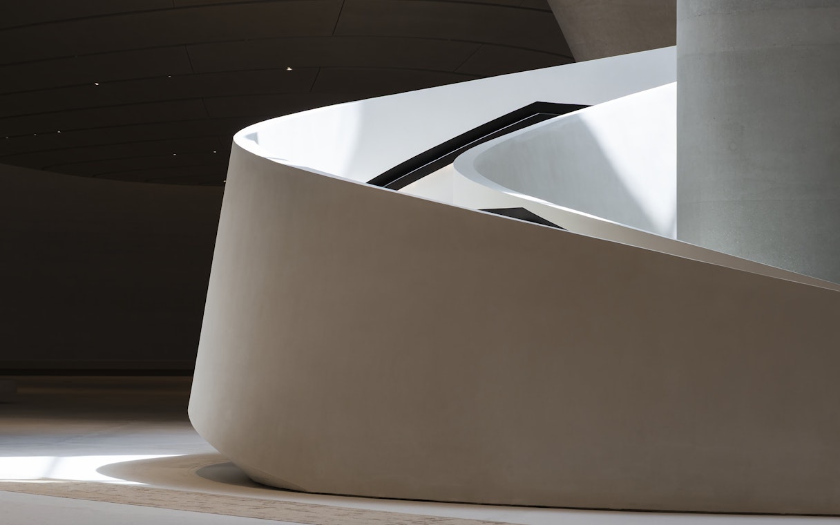 Curved architectural detail of Zayed National Museum exterior in Abu Dhabi.